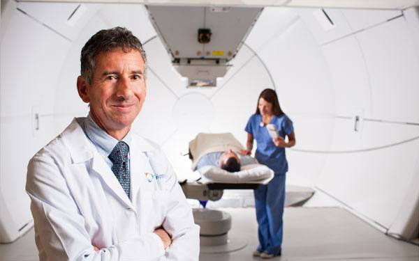 Dr-Carl-Rossi-in-treatment-room-2-600×375