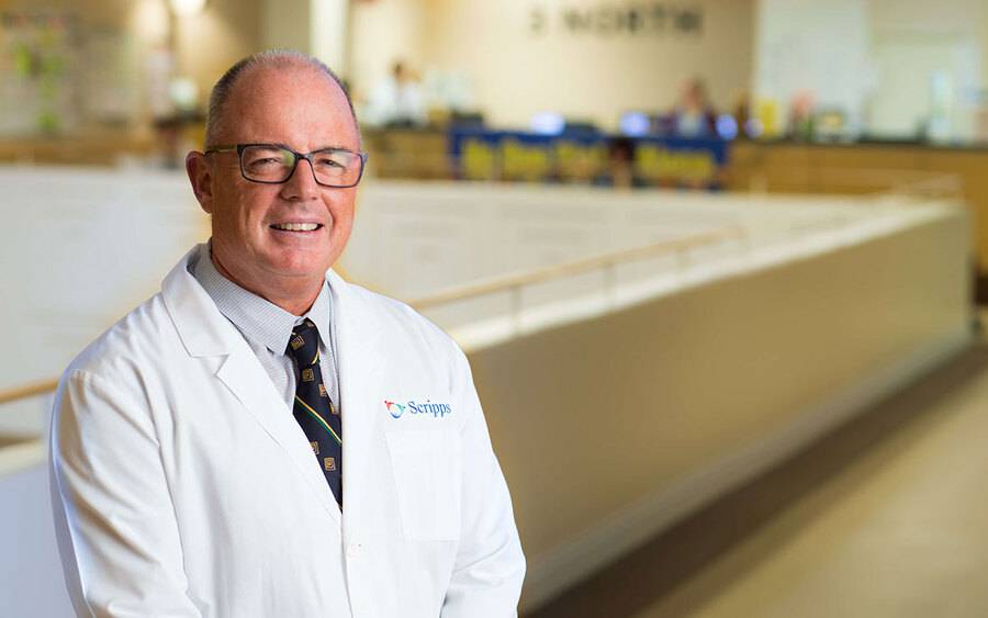 Dr. Christopher Marsh smiles in a hallway in Scripps Green Hospital in San Diego.
