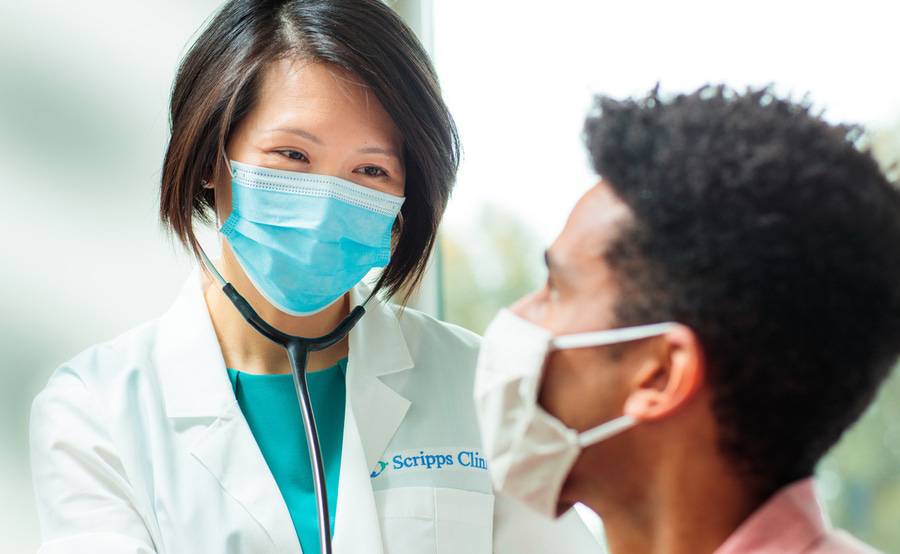 Dr. Siu Ming Geary, Internal Medicine, Scripps Clinic with a patient.