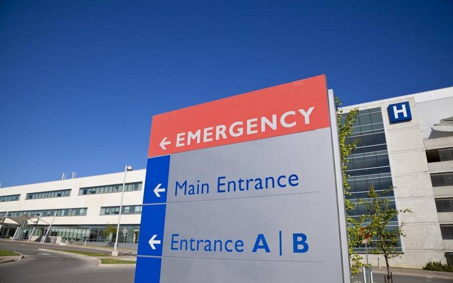 Sign directs patients and visitors to the emergency room entrance.