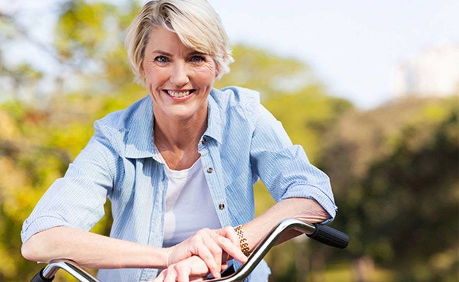 A smiling mature woman represents the full life that can be led after endometrial cancer treatment.