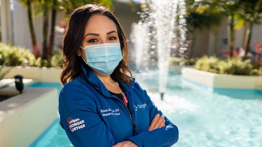 Erica Vargas, RN standing outside with a face mask and a Scripps jacket on, one of the eight Scripps Nurses of the Year 2020.