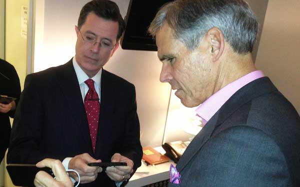 Dr. Topol uses a smartphone device to check Steven Colbert’s electrical heart activity backstage before taping “The Colbert Report.”