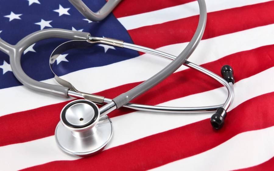 A stethoscope on an American flag represents what's next for health care after the 2016 Trump election.