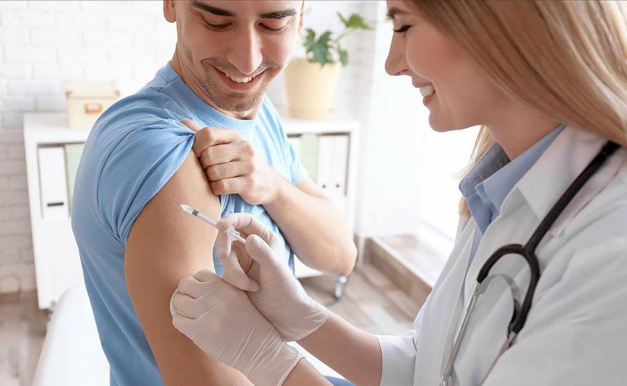 A man gets an annual flu shot at a clinic.