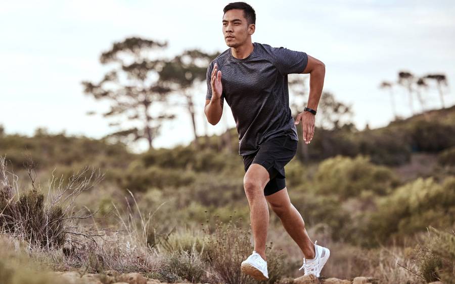 A young Asian man runs on a trail outdoors thanks to Scripps orthopedic surgeons who have several new, innovative procedures to help get patients back on their feet faster.  