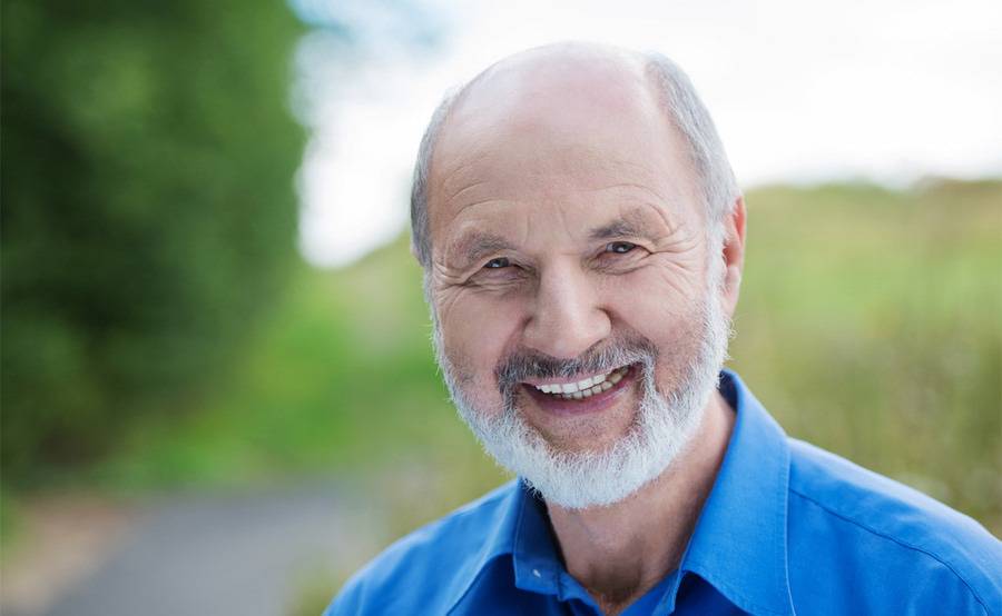 An man enjoying the outdoors, smiling