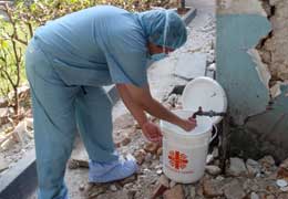 Surgeon scrubbing for surgery in Haiti