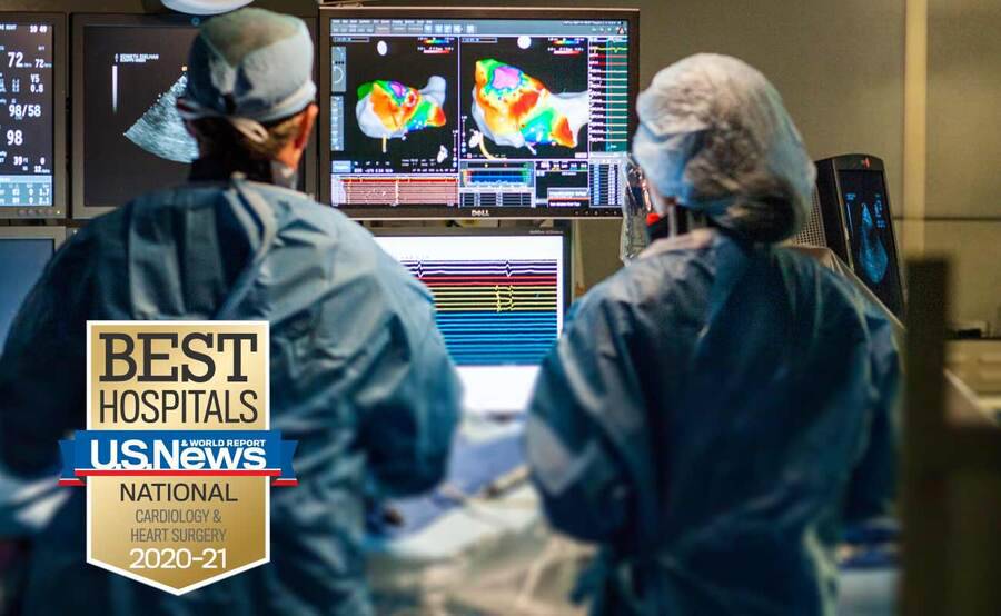 Two Scripps electrophysiologists study an image during an arrhythmia procedure.