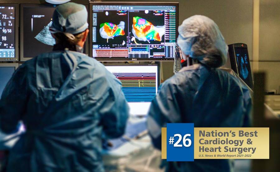 Two Scripps electrophysiologists study an image during an arrhythmia procedure.