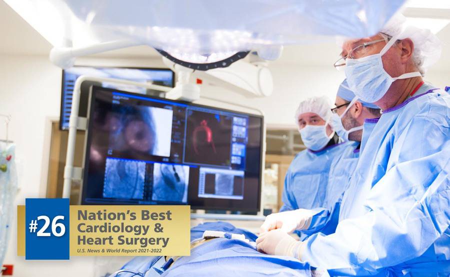 Scripps cardiothoracic surgeon Scot Brewster, MD, and colleagues review a heart attack patient's imaging results.