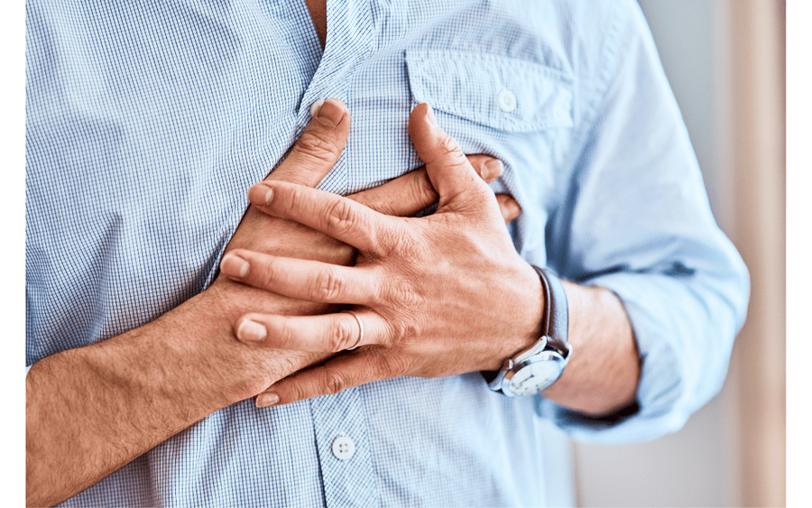A man holds his chest thinking it's heartburn. Could it be a  heart attack?