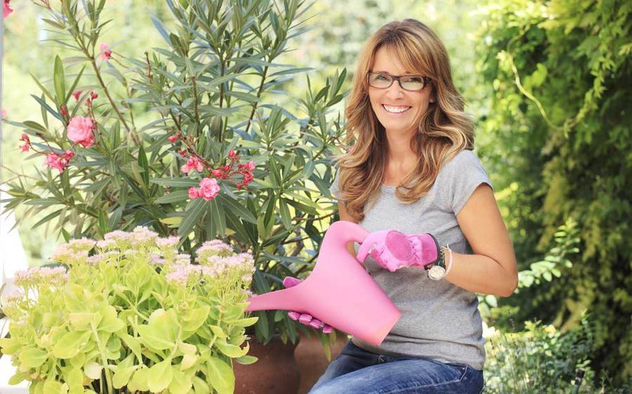 Happy mature woman gardening