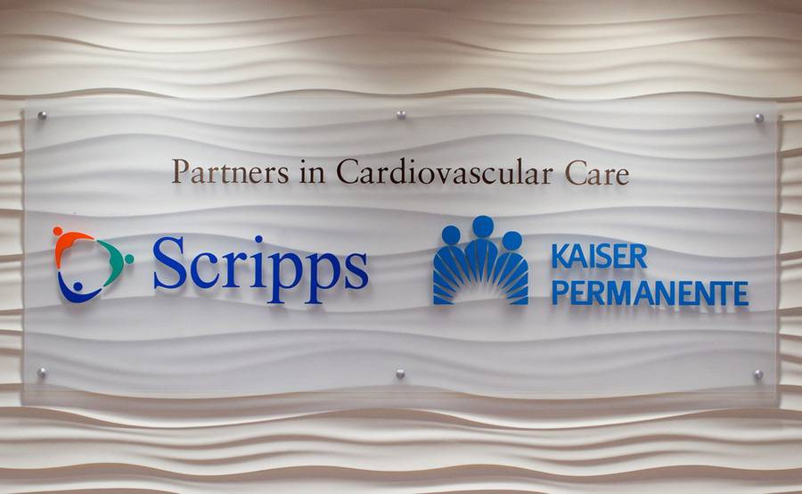 Large wall sign showcasing Scripps and Kaiser Permanente partnership sign.
