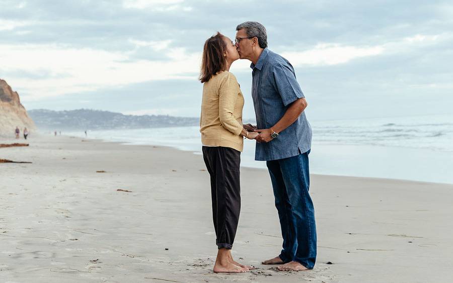 Annabelle and Robert Villarreal share a kiss on a San Diego beach following Annabelle's successful kidney transplant.