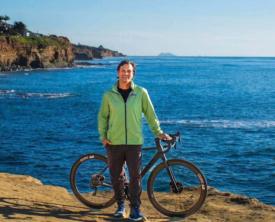 Ironman athlete Isaac Sanchez, 54, pictured with his bike along the San Diego coastline after recovering from head and neck cancer.