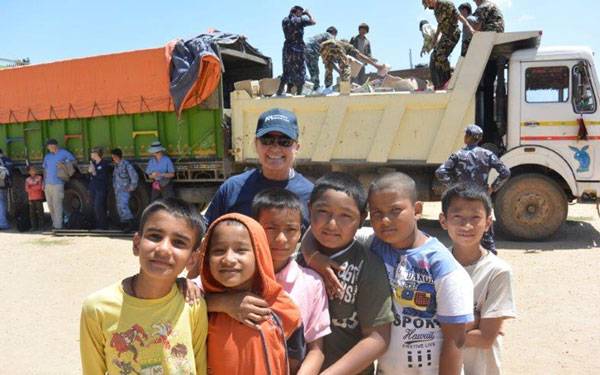 Jan Zachry, RN, vice president and chief nursing executive of Scripps Memorial Encinitas, with Nepalese children.