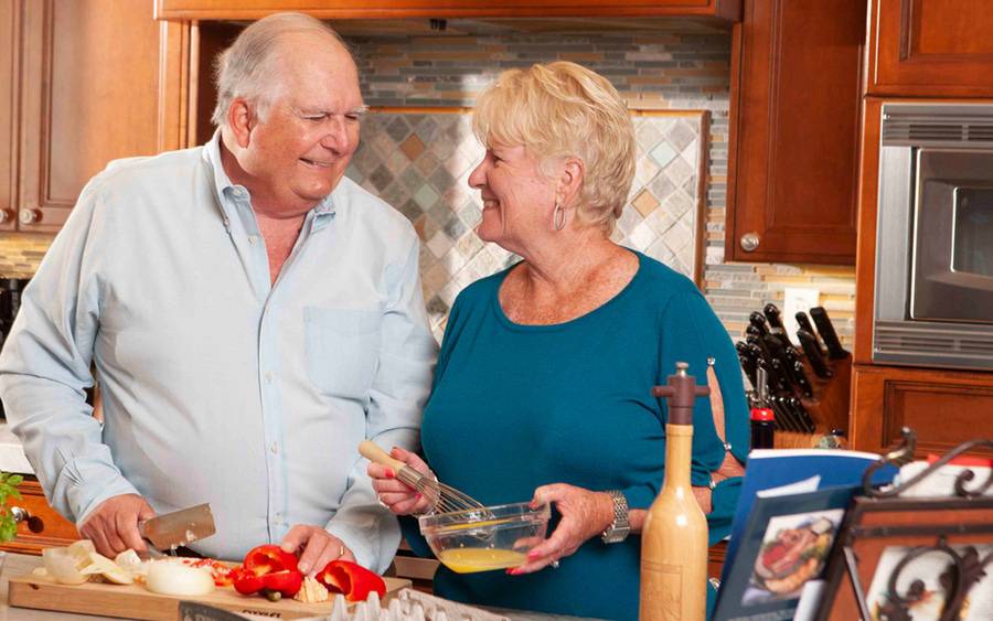 John Taylor and his wife prepare a Thanksgiving meal after minimally invasive surgery to remove a brain tumor restored his vision. SD Health Magazine