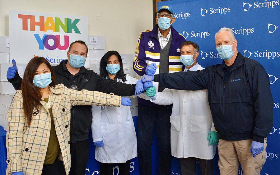 Kareem Abdul-Jabbar poses with staff from Scripps Health in San Diego, where he donated safety googles for COVID-19 response.