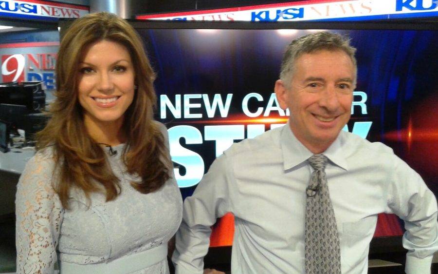 Scripps proton expert, Carl Rossi, MD, smiles alongside a news anchor during an interview about cancer care advancements.