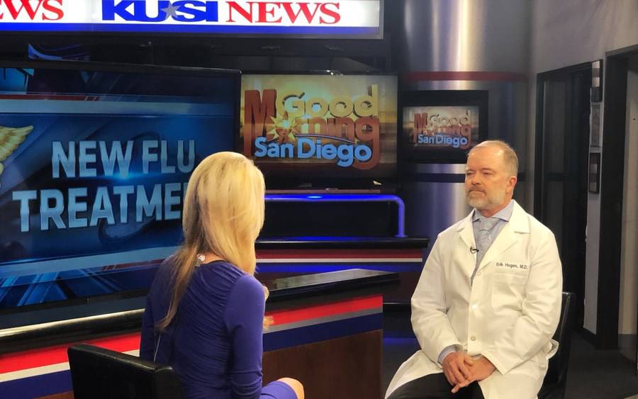 Dr. Erik Hogen discussing flu trends in San Diego with KUSI host Lauren Phinney.