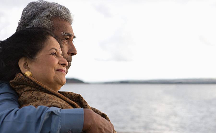 A smiling Hispanic couple represents the full life that can be led after liver cancer treatment.