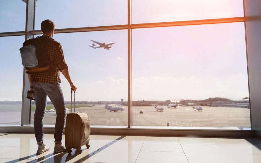 A long-distance traveler waits at the airport.