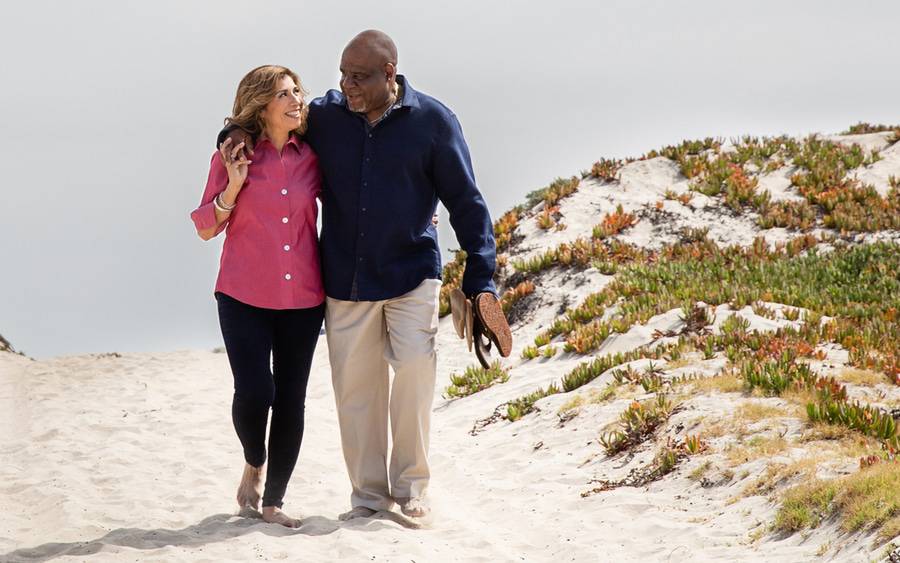 Elizabeth Mireles Riggs, smiling with her husband Michael in nature. The photo shows her before bariatric surgery that helped her lose more than 100 pounds.