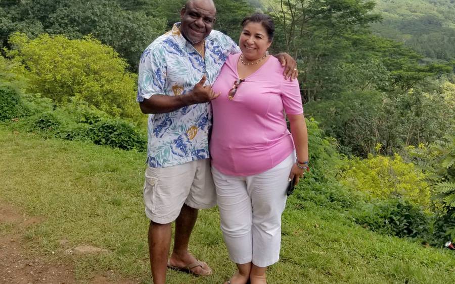 Elizabeth Mireles Riggs, smiling with her husband Michael in nature. The photo shows her before bariatric surgery that helped her lose more than 100 pounds.