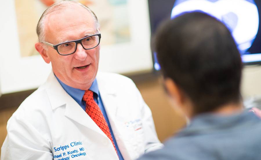 Oncologist and lung cancer expert Dr. Michael Kosty talks with a patient at Scripps in San Diego.
