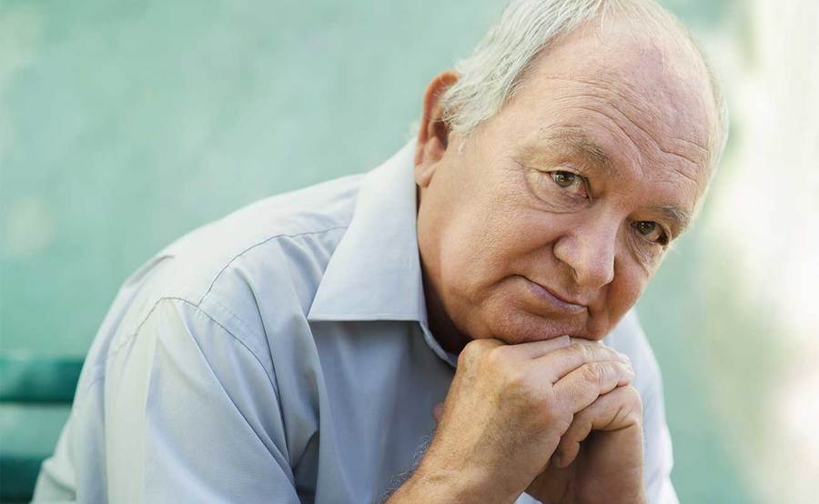 A serious mature man represents the power and value of knowing lung cancer symptoms.