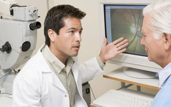 Is a legally blind patient a candidate for macular degeneration treatment?