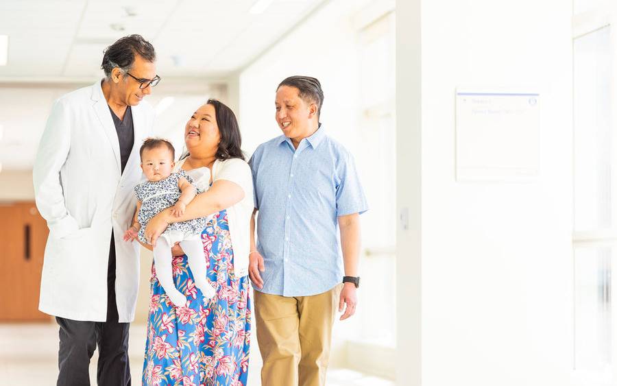 Mai Vue with husband Richard and baby daughter Athena  talk with with Scripps Clinic's Shaharm, Daneshmand, MD at Scripps Memorial Hospital La Jolla.