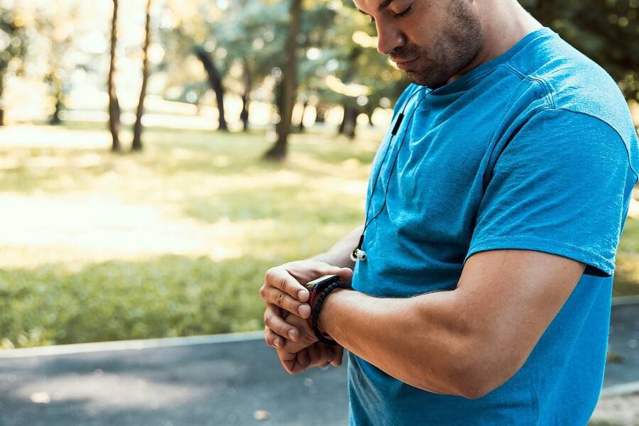 A man who thinks he may have AFib checks his smartwatch for signs of an irregular heartbeat.