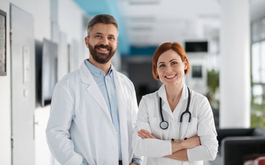 Young physicians. One is an MD and the other is a DO.