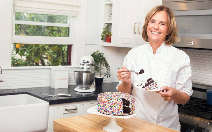 Melanie Petersen, a Scripps MD Anderson cancer patient, enjoys a piece of chocolate cake after surviving cancer.