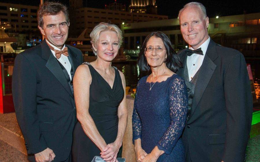 March 11 is the date for the 45th Annual Mercy Ball. Shown are past event attendees, include Scripps CEO Chris Van Gorder.