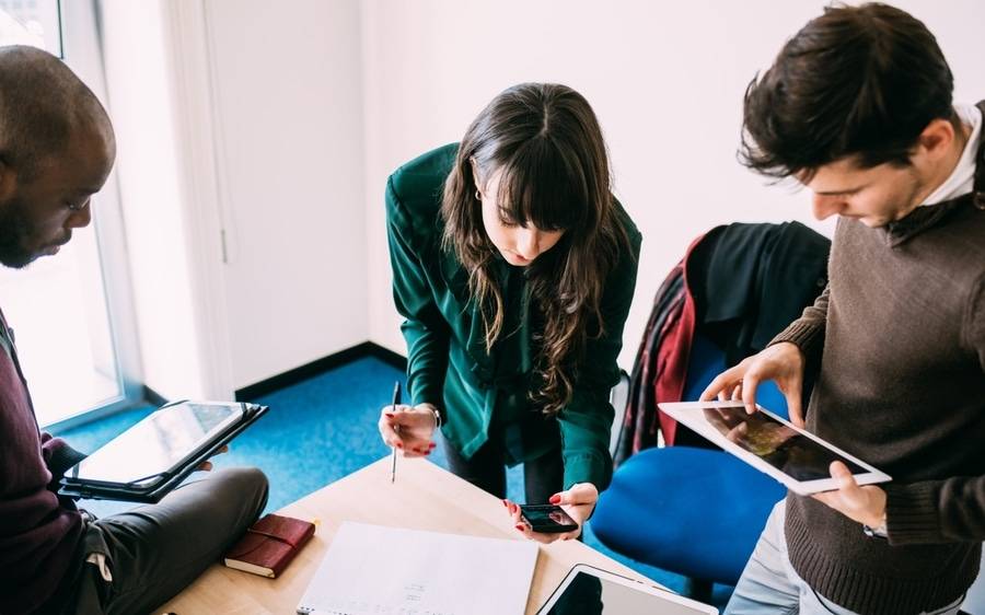 Millennial co-workers, a demographic with a solid workforce program at Scripps that earned media coverage, review a project.