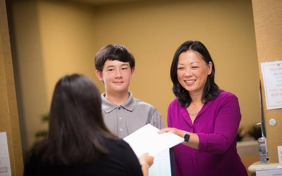 Mother and son check in at new Scripps HealthExpress Hillcrest