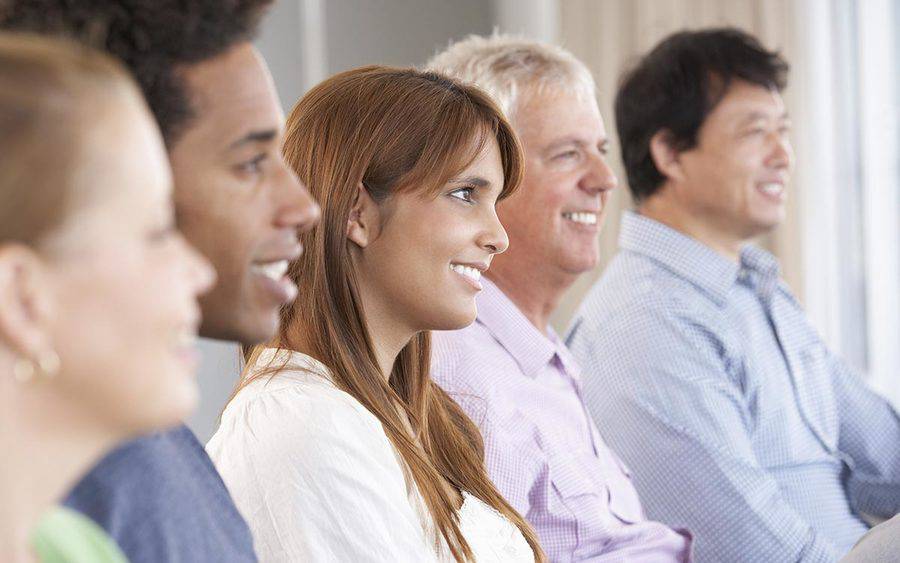 A group of adults listens to a speaker, representing the 2018 Multiple Sclerosis Lecture Series at Scripps.