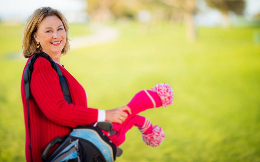 Heart attack survivor, Cheri Jones, carries a golf bag and encourages more women to be aware of their heart health.