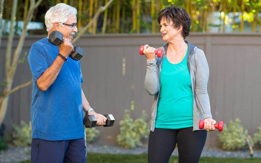 A mature couple work on strength training--one of five small health changes that lead to big results.