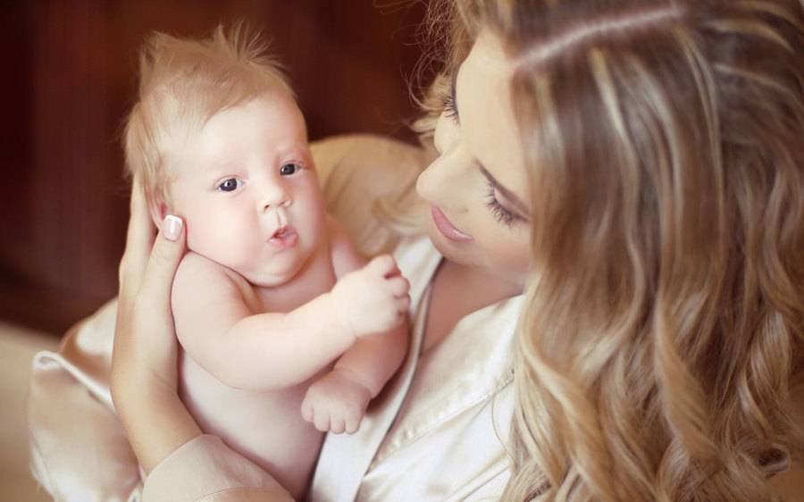 A mother and infant after breast feeding success at Scripps Memorial Hospital Encinitas whose program was covered by KPBS.