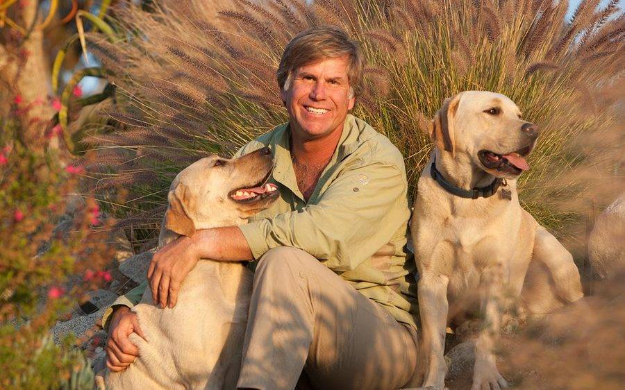 Roy Toft, a renowned wildlife photographer, enjoys a happy moment with his two Labradors following two hip replacements.