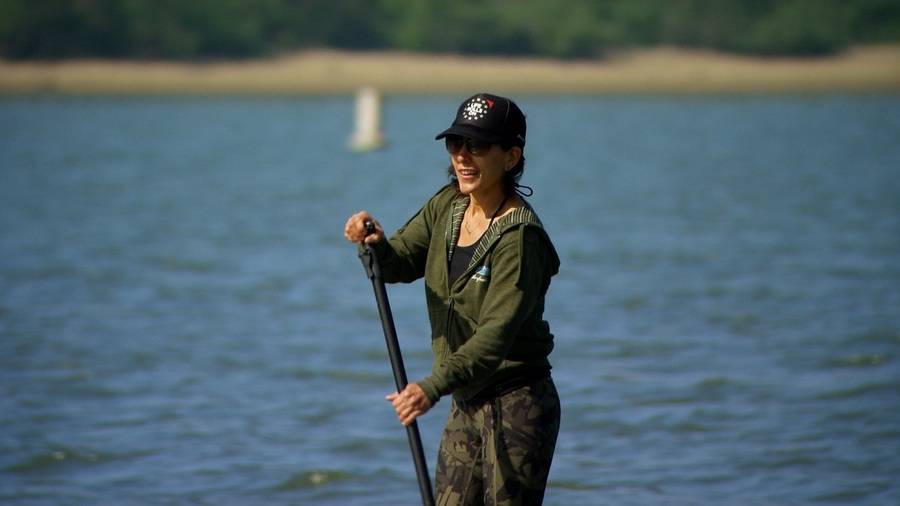 Oceanside policewoman, Angela Guerra, stand up paddles along the San Diego Bay a year after her stroke.