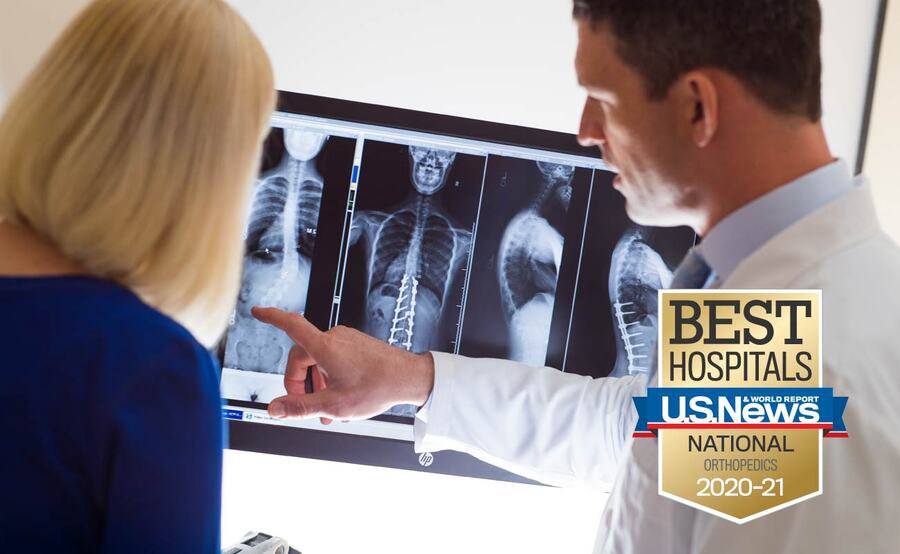 Scripps spine specialist Gregory Mundis, MD, reviews an X-ray of the spine with a patient.