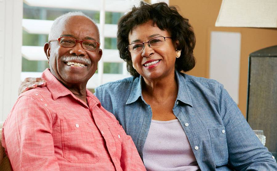 A smiling mature Black couple show how Scripps Health offers advanced treatment options for pancreatic cancer.