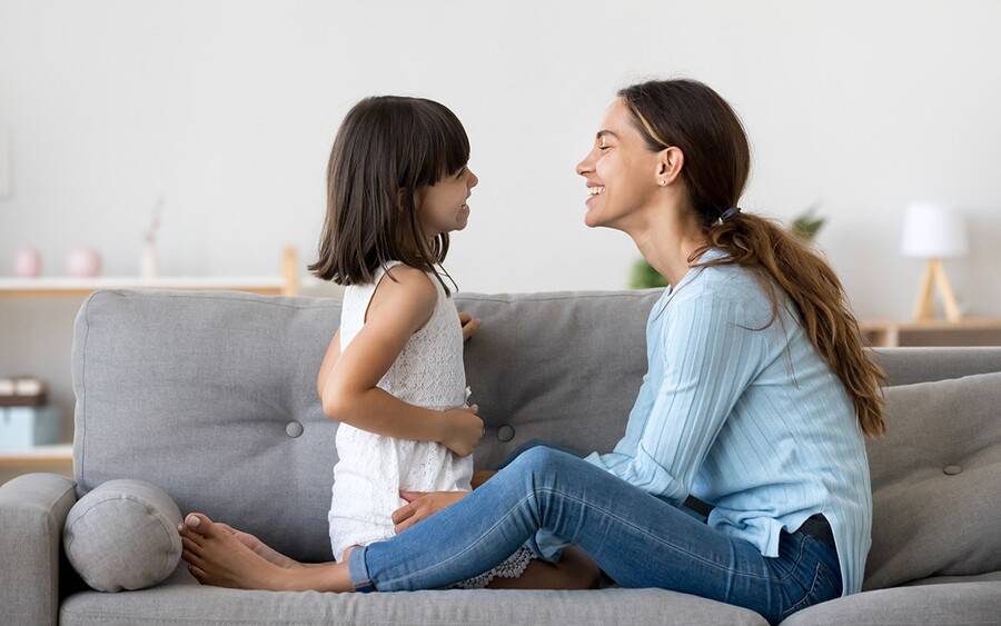 A mom enjoying a teaching moment with her daughter.
