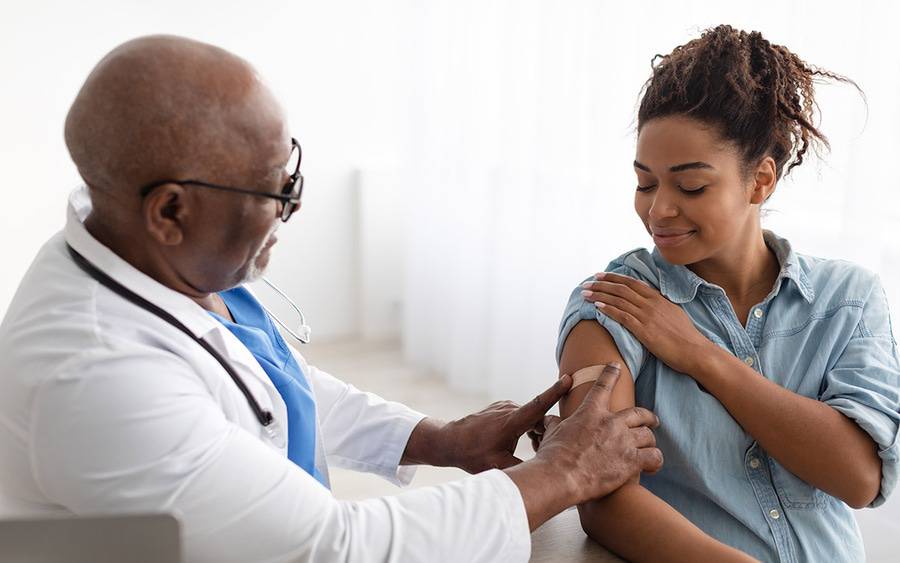 A provider and patient after the patient received a flu shot.