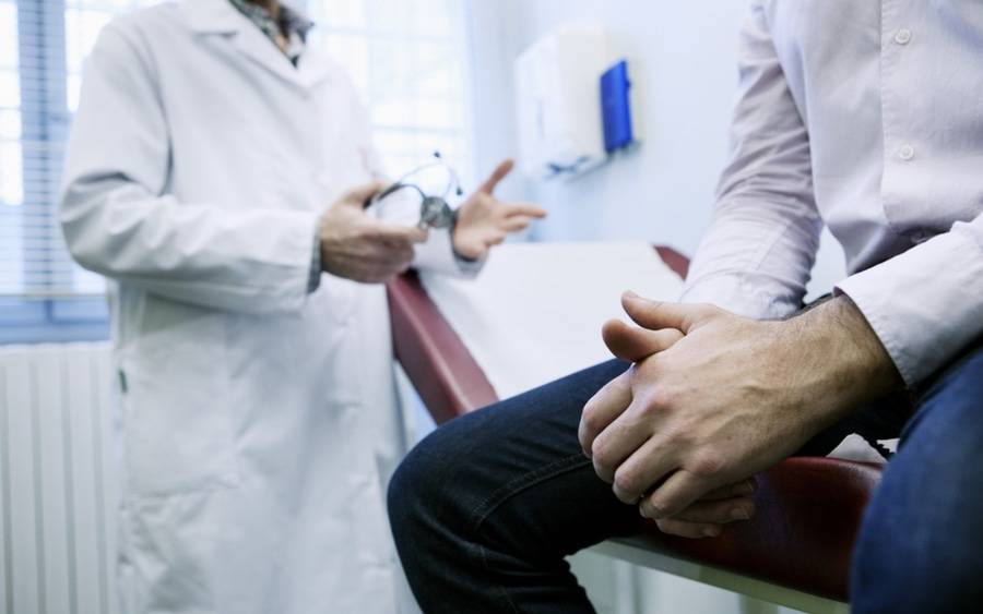 Prostate cancer patient discussing his status with his oncologist.